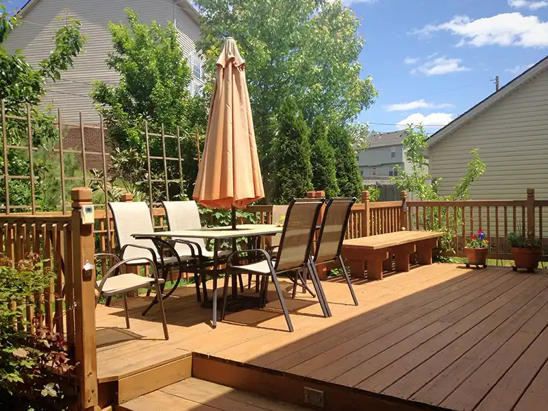 Large deck with outdoor furniture and plants